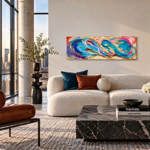 May include: A rectangular abstract painting featuring vibrant swirls of turquoise, deep blue, magenta, and gold paint. The artwork displays dynamic, fluid brushstrokes and layered textures, creating a sense of movement across the horizontal canvas.