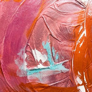 May include: An abstract painting featuring thick, textured layers of oil paint in shades of magenta, deep pink, and burnt orange. A central focal point displays bold, impasto strokes of bright turquoise and white, creating a dynamic surface.