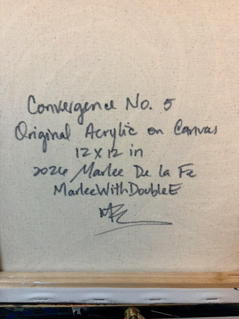 May include: A square canvas with handwritten black text that reads: Convergence No. 5, Original Acrylic on Canvas, 12 x 12 in, 2024, Marlee De la Fe, MarleeWithDoubleE, and a signature. The texture of the woven fabric is visible.