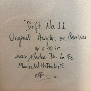 May include: A beige canvas surface featuring black handwritten text that reads: Drift No. 11, Original Acrylic on Canvas, 16 x 40 in, 2026, Marlee De la Fe, Marlee With Double E, and a stylized signature at the bottom.
