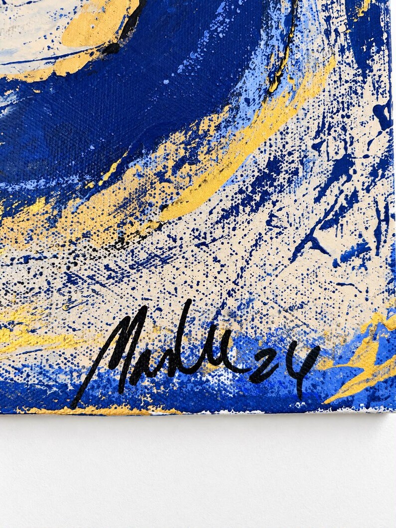 May include: An abstract painting on canvas featuring bold swirls of deep blue, bright yellow, and off-white paint. The texture is layered with splatters and thick brushstrokes. A black handwritten signature and the number 24 appear at the bottom.