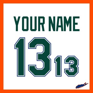 May include: A handmade wooden sign with the text "Welcome to our home" in a handwritten style. The sign is painted white with a dark stained frame. A small green plant is placed on the sign.