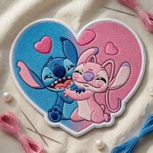 May include: Embroidered patch featuring Stitch and Angel embracing within a heart shape. The patch is divided into blue and pink sections, with heart-shaped accents. Pink and blue thread, needles, and pearls surround the patch.