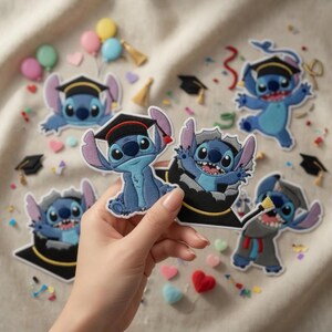 May include: Embroidered patches featuring the character Stitch in graduation attire. The patches are various sizes and poses, with Stitch wearing a graduation cap and gown. Scattered around are small graduation caps and confetti.