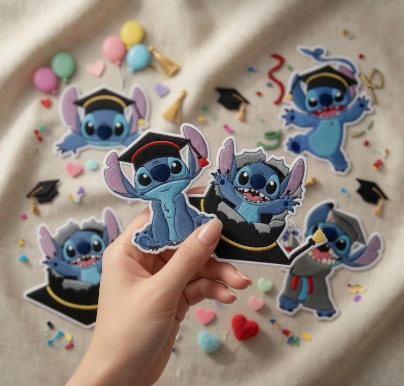 May include: Embroidered patches featuring the character Stitch in graduation attire. The patches are various sizes and poses, with Stitch wearing a graduation cap and gown. Scattered around are small graduation caps and confetti.