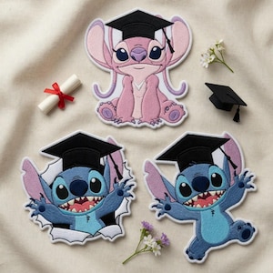 May include: Embroidered patches featuring characters from the animated film, wearing graduation caps. The patches include a pink character, and two blue characters. A rolled diploma with a red ribbon and small white flowers are also present.