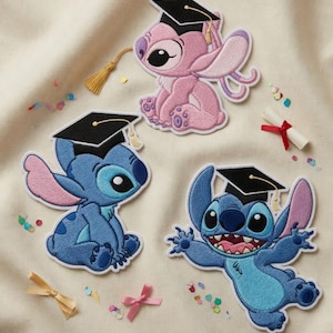 May include: Embroidered patches featuring Stitch and Angel characters wearing graduation caps. The patches are in shades of blue and pink, with black caps and gold tassels. Confetti and a rolled diploma with a red ribbon are also present.