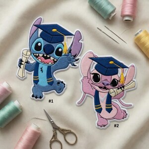 May include: Embroidered patches featuring cartoon characters Stitch and Angel, both wearing graduation caps and holding diplomas. Stitch is blue, Angel is pink. The patches are surrounded by sewing supplies, including thread spools and scissors.