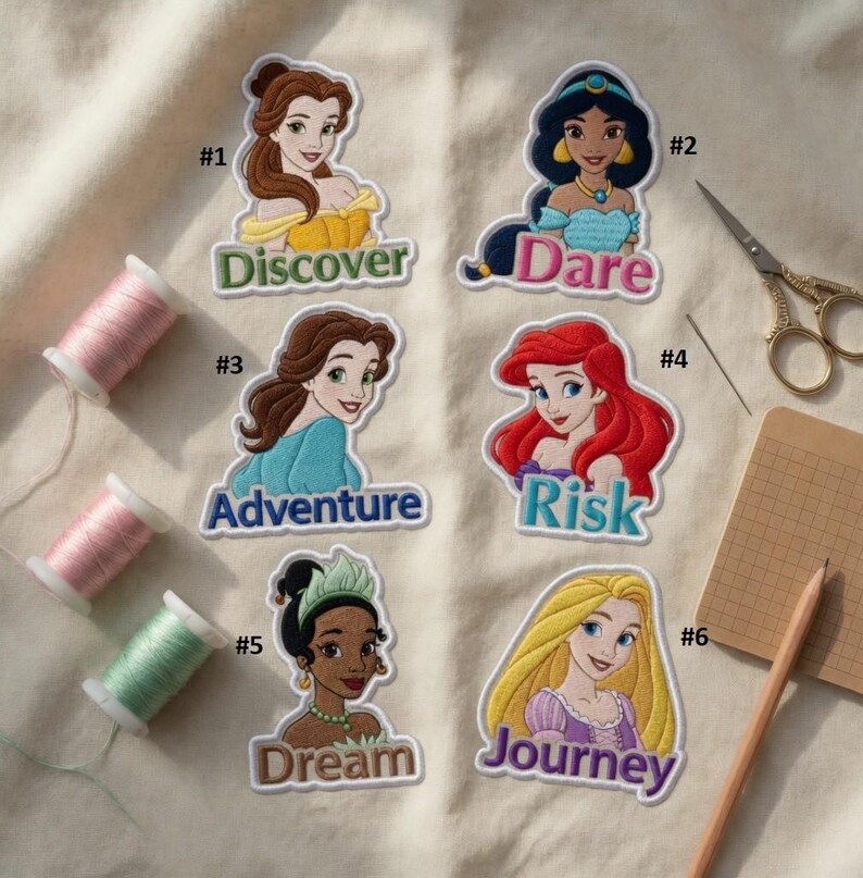 May include: Six colorful embroidered patches featuring cartoon princesses with text: Discover, Dare, Adventure, Risk, Dream, and Journey. The patches are on a cream-colored fabric, with spools of thread and sewing tools.