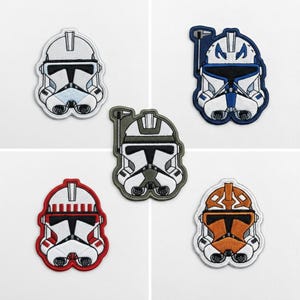 May include: A rustic wooden sign with the text "Welcome to our home" in white lettering. The sign features a distressed finish and a simple, inviting design, perfect for front door decor.