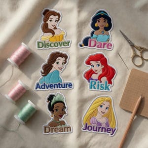 May include: Embroidered patches featuring Disney princesses with the words "Discover," "Dare," "Adventure," "Risk," "Dream," and "Journey." The patches are colorful and detailed, with a white border. Sewing supplies, including thread and scissors, are also visible.