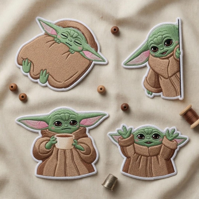 May include: Four embroidered patches featuring a green alien character with large ears and brown robes. One patch shows the character sleeping in a brown blanket. Other patches show the character peeking, holding a cup, and with arms raised.