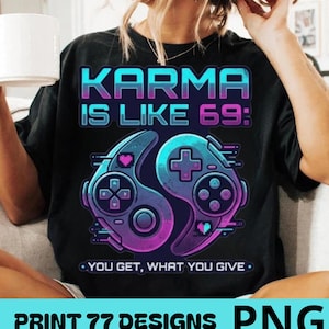 May include: A black t-shirt featuring a graphic print with the text KARMA IS LIKE 69: YOU GET, WHAT YOU GIVE. The design includes two stylised video game controllers arranged in a yin-yang shape with pixelated hearts and a neon blue and purple colour scheme.
