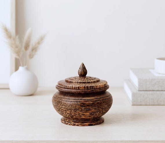A hand-turned Thai teak round trinket box with an organic, sculptural shape that looks like it belongs in a design museum — not a craft fair.