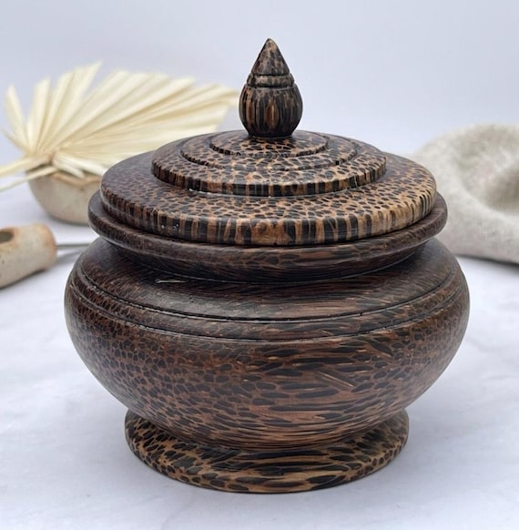 A hand-turned Thai teak round trinket box with an organic, sculptural shape that looks like it belongs in a design museum — not a craft fair.