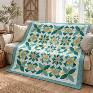 May include: A quilt featuring a repeating geometric pattern in shades of teal, yellow, and grey on a white background. The design consists of alternating star-like shapes and four-petal floral motifs, finished with a solid teal border.