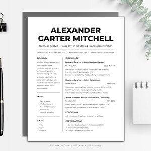 May include: A black and white resume template with the name "Alexander Carter Mitchell" at the top. A black pen, a black binder clip, and a small white notepad are on the left and right sides of the resume.