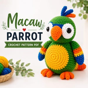 May include: A crocheted macaw parrot toy featuring a green body, a yellow belly, an orange beak, and blue and orange wing accents. The text Macaw PARROT CROCHET PATTERN PDF is displayed to the left of the toy, accompanied by a small red heart icon.