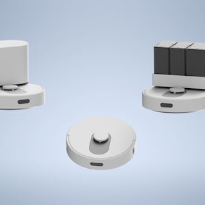 May include: Three white robotic vacuum cleaners are displayed against a light blue background. One is upright with a rectangular top, another has a rectangular top with three black boxes, and the third is a circular base with a small raised center.
