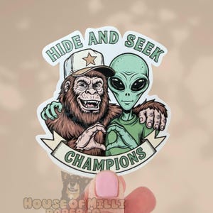 Aliens and Big Foot Joke Sticker: Raised Vinyl- Hide and Seek Champions Retro Sarcastic Decal for Water Bottles, Laptops, Planners and More