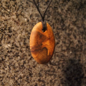 Olive wood slice necklace Wood pendant Sustainable jewelry Genuinely handmade