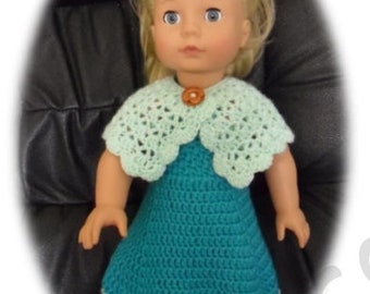 May include: A doll wearing a teal crochet dress with a light green crochet collar and a brown button. The doll has blonde hair and blue eyes.