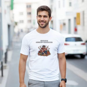 May include: White t-shirt featuring a cartoon illustration of a person surrounded by gifts. The text reads "TEACHER BY DAY, FRAZZLED GIFT - WRAPPED BY NIGHT." The design uses red and brown colours.