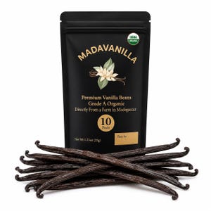 May include: A black stand-up pouch labeled MADAVANILLA containing 10 Grade A Organic Premium Vanilla Beans from Madagascar. The packaging features a vanilla flower illustration, USDA Organic seal, and states a net weight of 1.23oz.