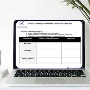 May include: A laptop displaying a "COMMON FORMATIVE ASSESSMENT-STUDENT TASK ANALYSIS" form. The form includes sections for "Know/Show," "#Questions," and "Question Format(s)." A white mug and a potted plant are visible.