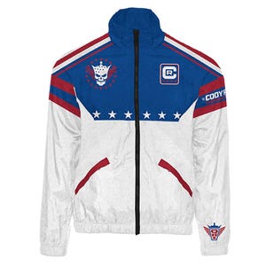 May include: White and blue zip-up jacket with red accents. Features a skull and crown emblem, stars, and the text "Cody R". The jacket has a high collar and a full-length black zipper. A logo is on the lower right.