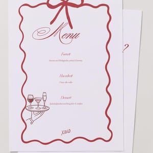 May include: White menu cards with a red border and bow design. The word "Menu" is written in cursive. The menu includes sections for appetizers, main course, and dessert. The bottom of the card says "xoxo".