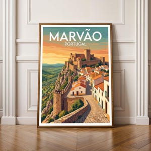May include: A framed art print of Marvão, Portugal. The image shows a castle on a rocky hill, with a road leading to the town. The sky is orange and yellow. The text "MARVÃO PORTUGAL" is at the top. The print is in a wooden frame.