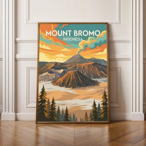 May include: A framed art print depicting Mount Bromo, Indonesia, in a retro style. The artwork features a colourful sunset with orange, yellow, and blue tones. The image includes volcanic peaks, craters, and silhouetted trees.