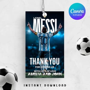May include: A black tag with the text "MESSI" and "THANK YOU" in white. The tag features a soccer player in a blue and white jersey. The text "FOR JOINING US WITH LOTS OF LOVE AMELIA AND JOHN" is also present. A soccer ball is in the background.