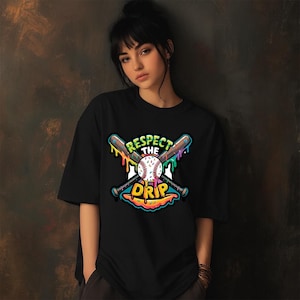 May include: Black t-shirt featuring a baseball-themed graphic. The design includes crossed baseball bats, a baseball, and the text "Respect the Drip" in a colorful, dripping font. The shirt is a casual, short-sleeved style.