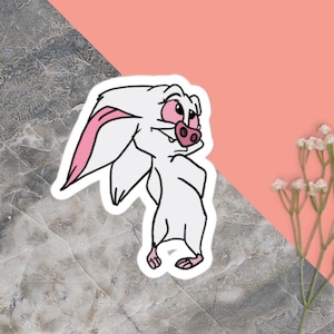 以下が含まれることがあります： 耳、鼻、足にピンクのアクセントが付いた白い漫画のコウモリのステッカー。 コウモリは笑顔で、遊び心のある表情をしています。 ステッカーはピンクと灰色のマーブル模様の背景にあります。