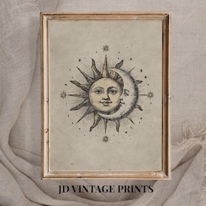 May include: A framed vintage print depicting a celestial scene with the sun and moon intertwined, encircled by stars. The artwork is in a gold-toned frame, with the text "JD VINTAGE PRINTS" at the bottom.
