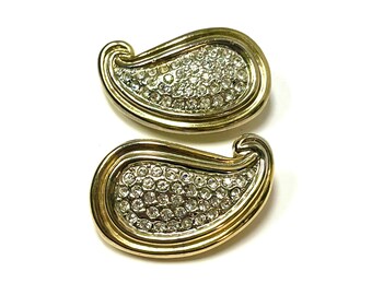 May include: A pair of gold-tone paisley-shaped earrings with clear rhinestone accents.