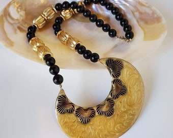 Vintage bead necklace gold and black with large enameled pendant, 1970's