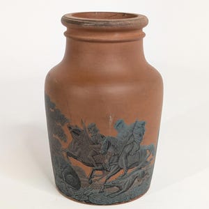 May include: A set of three ceramic mugs with a speckled, matte finish. The mugs are in shades of cream, light gray, and dark gray. Each mug has a simple, minimalist design and a rounded handle.