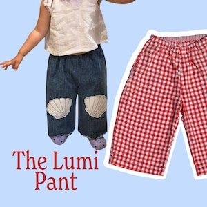 May include: The Lumi Pant is a pair of red and white gingham trousers with an elastic waistband. The image also displays a child wearing blue denim pants with white seashell graphics on the knees and a size chart ranging from 0-3 months to 7 years.