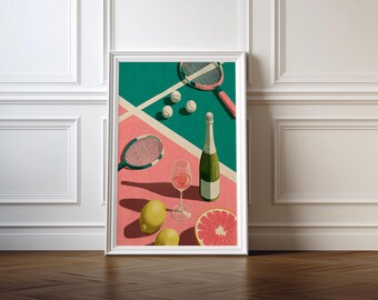 May include: Framed art print depicting a tennis court with rackets, balls, and a champagne bottle. A glass of pink drink, lemons, and a grapefruit half are also shown. The color scheme includes green, pink, and white.