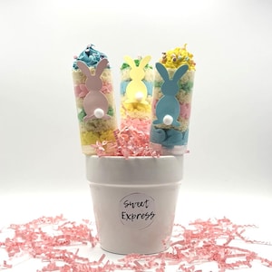 May include: A handmade wooden sign with the text "Welcome" in a playful font. The sign features a distressed white background and a dark brown frame, perfect for a front door or entryway.