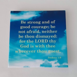 May include: A blue and white inspirational quote card with a sky background and clouds. The quote reads "Be strong and of good courage; be not afraid, neither be thou dismayed: for the LORD thy God is with thee wherever thou goest." The quote is attributed to Joshua 1:9.