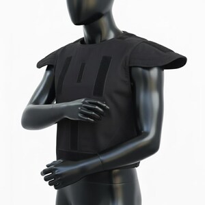 May include: Black tactical vest with shoulder pads and multiple vertical velcro straps. The vest is displayed on a black mannequin against a white background. The vest appears to be made of a durable, matte material.