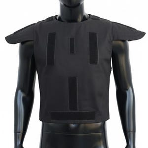 May include: Black tactical vest with shoulder pads and multiple Velcro panels. The vest is displayed on a black mannequin. This protective gear is designed for security and law enforcement.