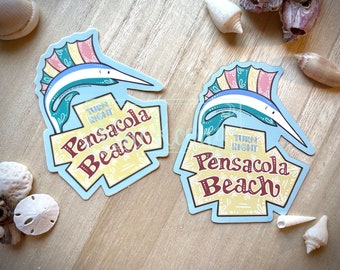 May include: Two blue and yellow stickers with a cartoon marlin fish and the text "Turn Right Pensacola Beach".