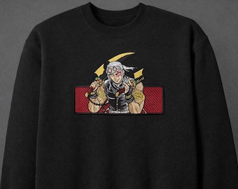 May include: Black sweatshirt featuring an embroidered patch of an anime character with white hair, goggles, and a determined expression. The patch is rectangular with a red background and gold accents. The character is holding two swords.