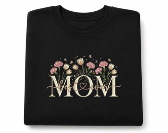 May include: Black sweatshirt with floral embroidery. The word "MOM" is embroidered in a cream color, with "best ever" in a script font. Pink and cream-colored flowers and leaves surround the text, with a heart in the center of the "O".