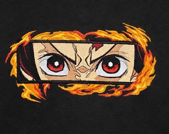 May include: Embroidered patch featuring anime-style eyes with red irises and a determined expression. The eyes are framed by a rectangular border and surrounded by stylized orange and yellow flames, set against a black background.